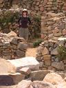 Ashe amongst the Incan ruins, which are situated right by the red rock considered the very birthplace of the Incan Sun God and the very first Incan.